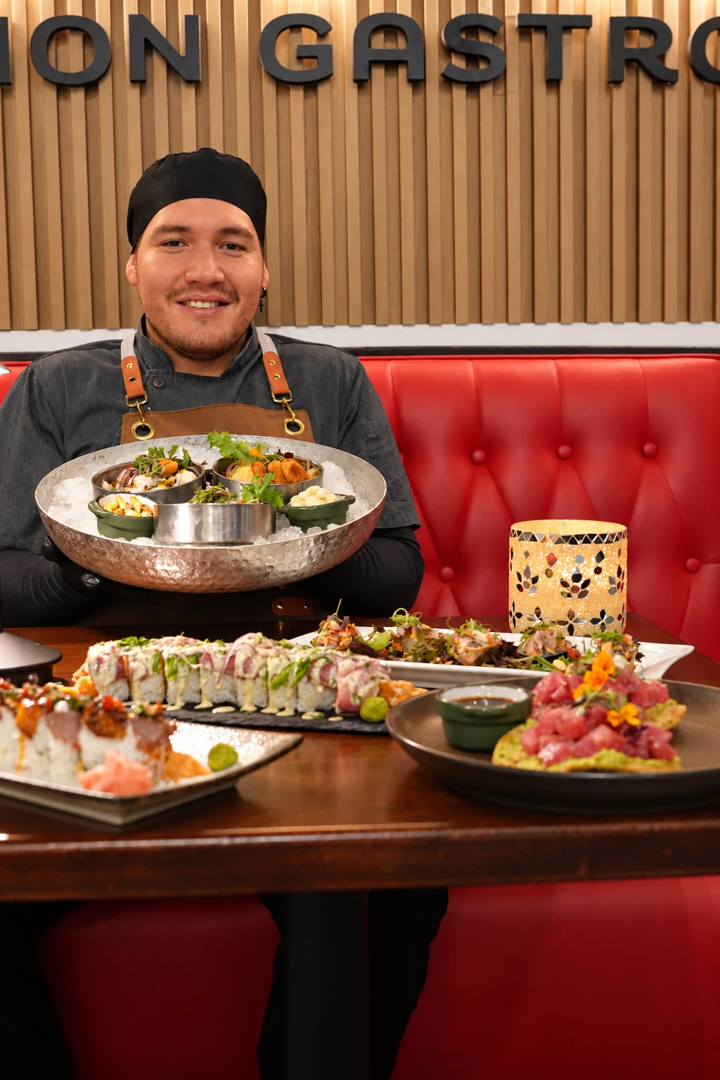 Chef presenting a dish at ALMA