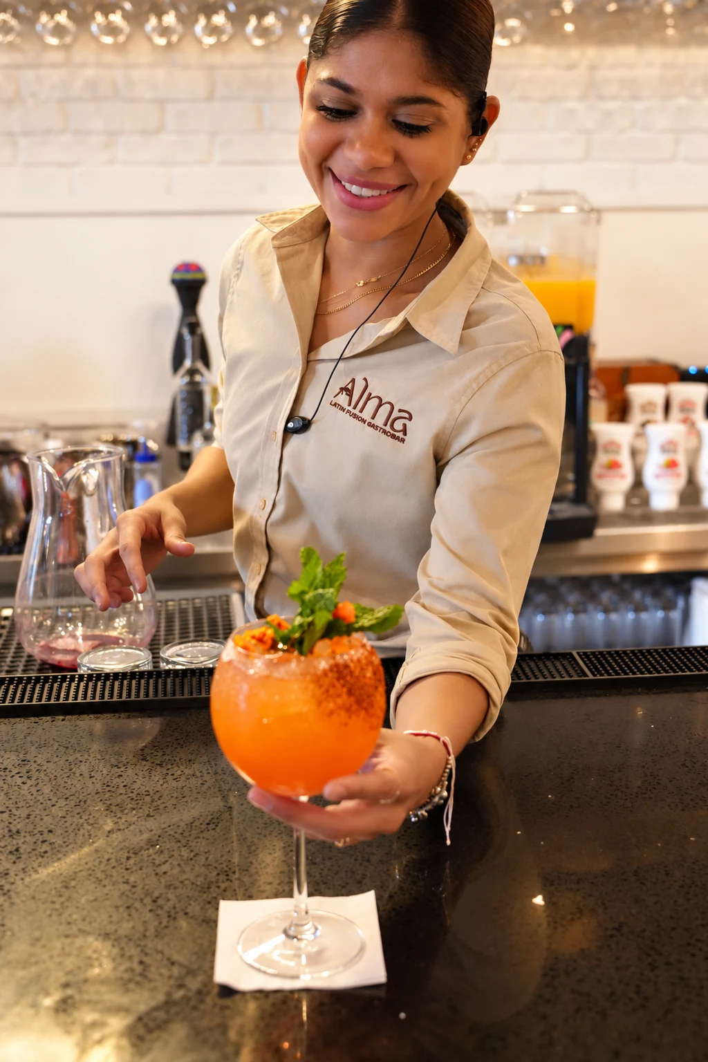 ALMA team member serving a cocktail